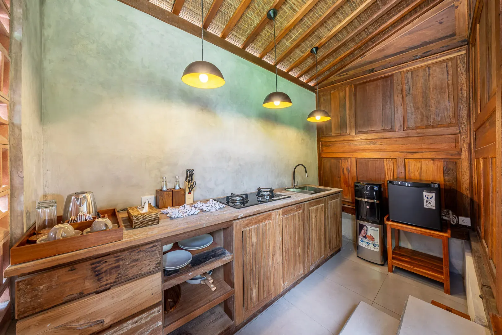 Modern equipped kitchen with full amenities at Saughina Ubud private villa